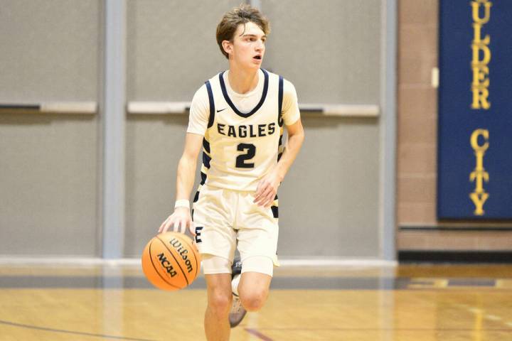 Robert Vendettoli/Boulder City Review Junior Luke Wright brings the ball up court against Moap ...