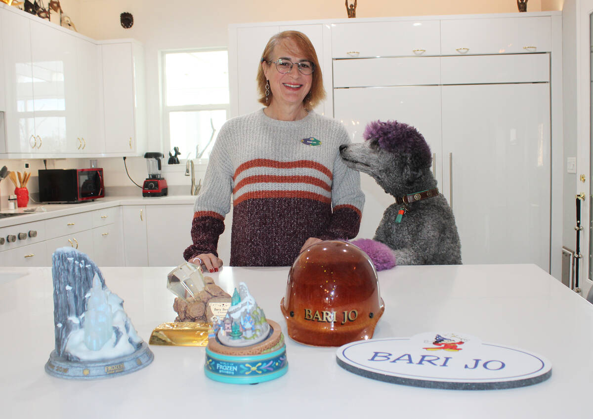 Ron Eland/Boulder City Review Bari Jo Berman, along with her dog Tinsel, stand in front of the ...
