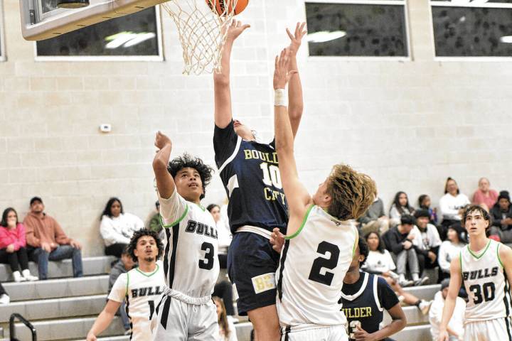 Robert Vendattoli/Boulder City Review Making his way to the rim, senior Roman Rose lays in a la ...