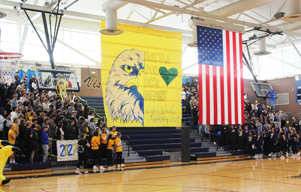 Students and faculty rose during the playing of the national anthem.
