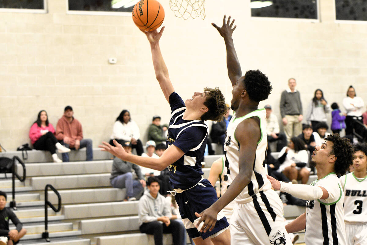 Robert Vendettoli/Boulder City Review Junior Easton Welbourne goes up for a layup against SLAM ...