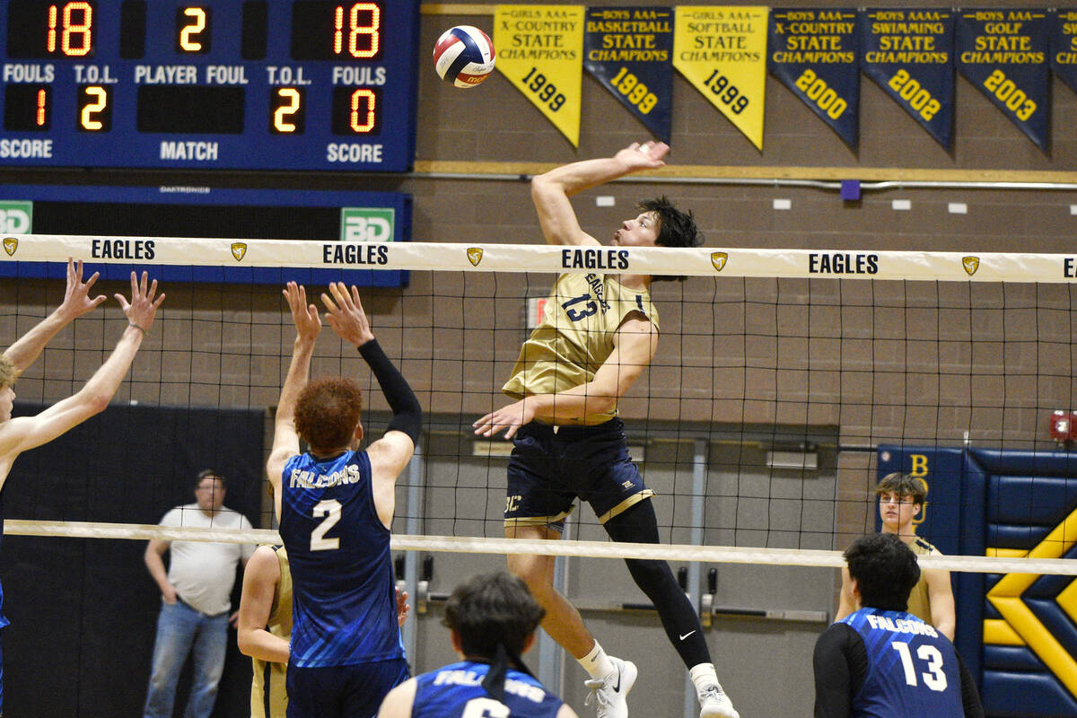 Robert Vendettoli/Boulder City Review Senior Travis Hess soars above the net for a thunderous k ...