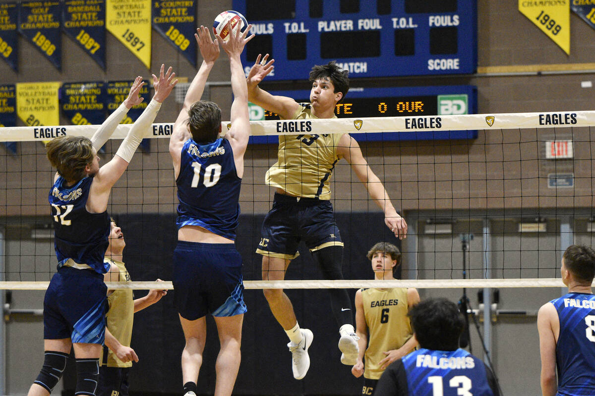 Robert Vendettoli/Boulder City Review Senior Travis Hess soars above the net for a thunderous k ...