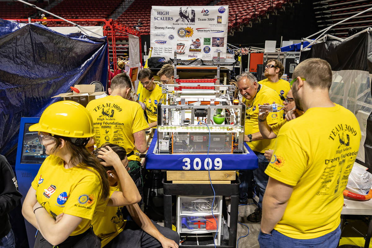 Photo courtesy of Yenor Photos The High Scalers (AKA Team 3009) in the pit area preparing the ...