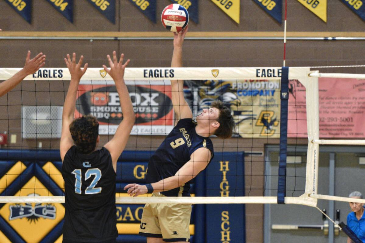 Robert Vendettoli/Boulder City Review Soaring above the net, senior Brady Sorenson throws down ...