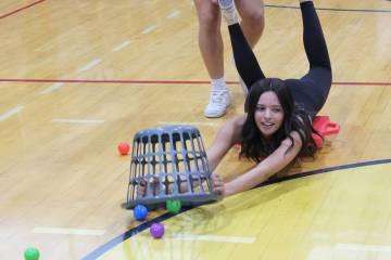 Sophomore Delaney Loeslein gets some assistance during the class challenge of Hungry, Hungry Hippo.