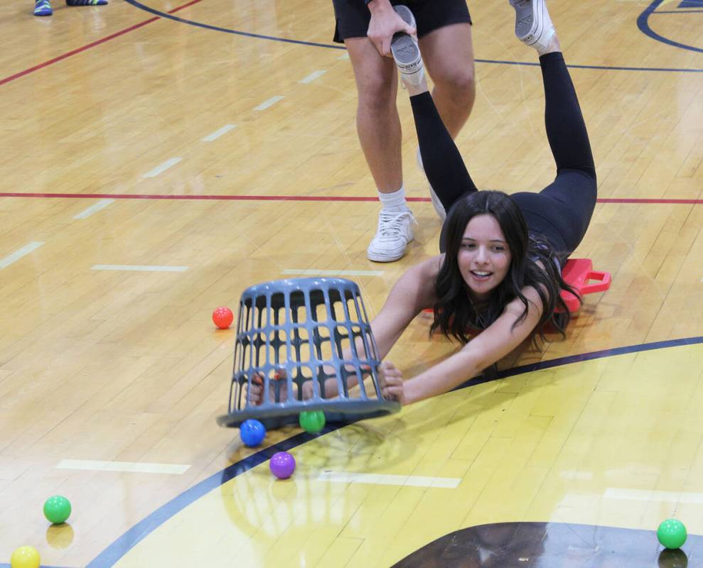 Sophomore Delaney Loeslein gets some assistance during the class challenge of Hungry, Hungry Hippo.