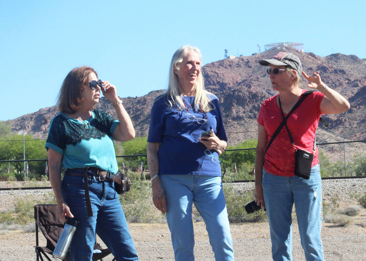 Artist Lynne Jordan, center, who painted the eagle, and others were on hand to watch the placem ...