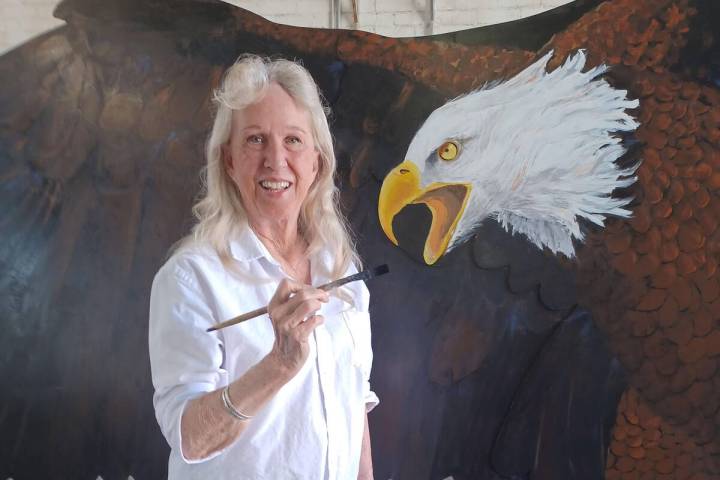 Photo courtesy Linda Barnett Lynne Jordan, during her painting of the eagle, which now sits out ...