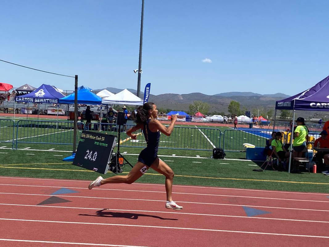 Photo courtesy Amy Wagner Sophomore Sancha Jenas-Keogh cruises to a win in the 200-meter dash i ...