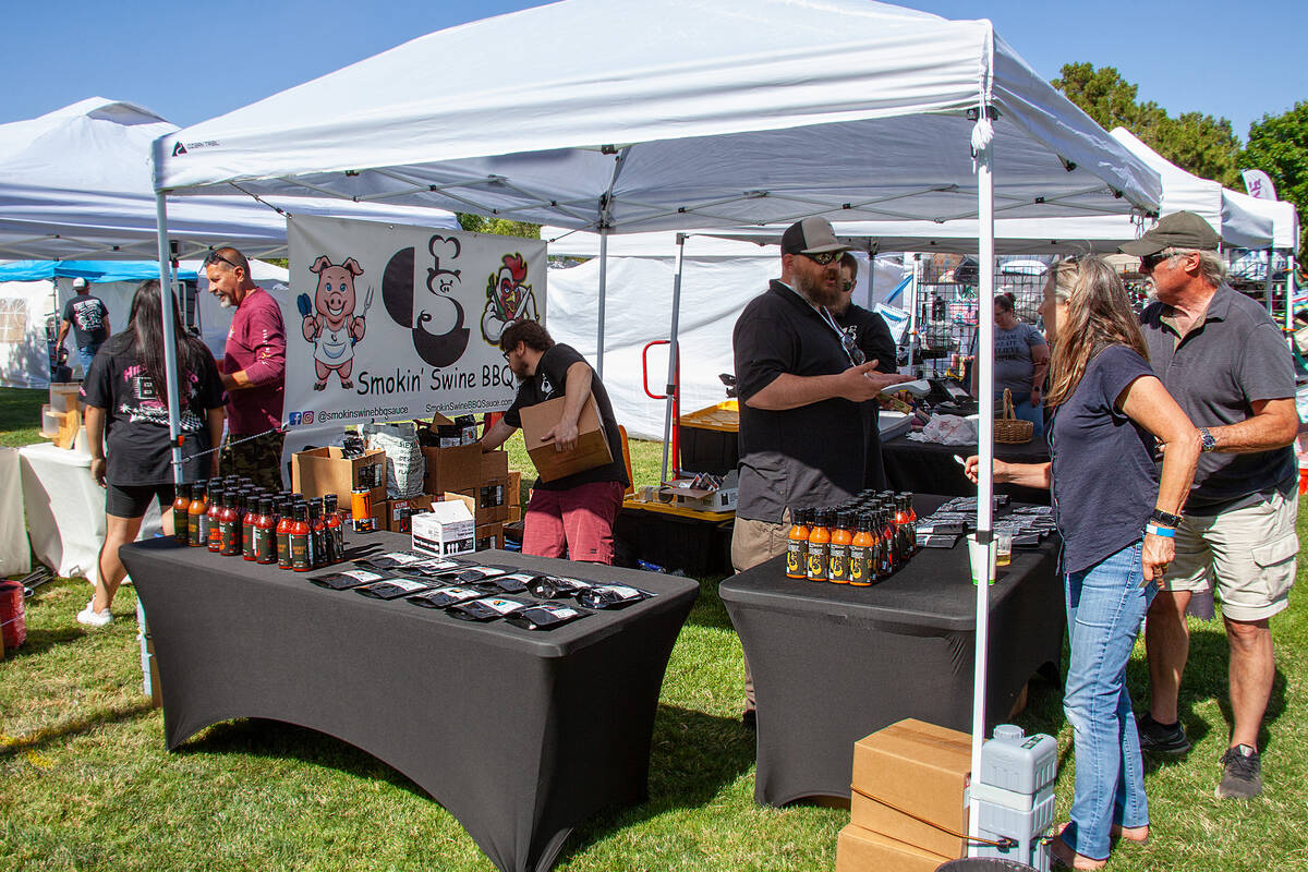 Linda Evans/FotoDiva Images The event was more than just meat. Here vendors selling barbecue sa ...