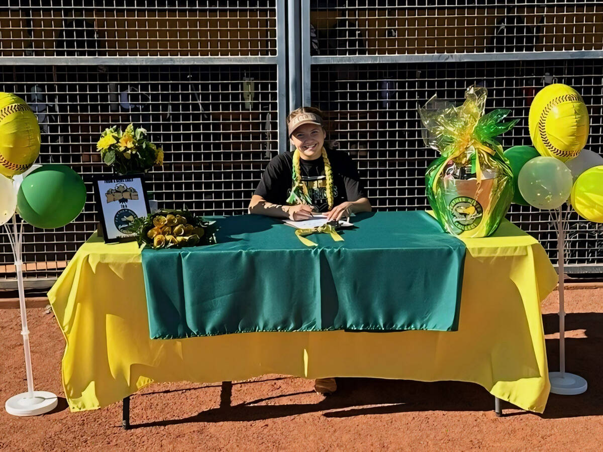 Photo courtesy Joianne Madrid Putting pen to paper, Boulder City senior Talynn Madrid signs wit ...