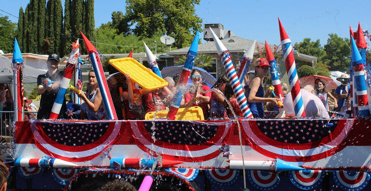 Those on this patriotic float came prepared once they entered the wet zone.