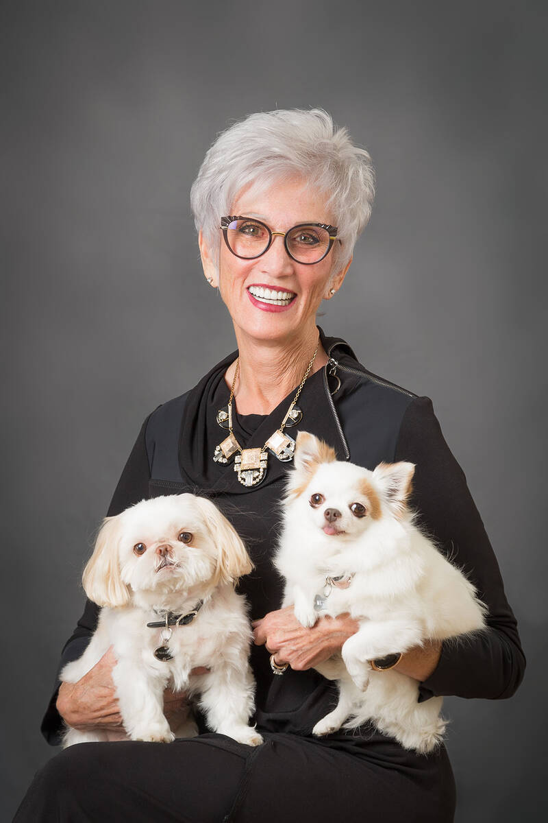 (Photo courtesy of Cokie Booth) Cokie Booth poses with two of her four dogs as a City Council c ...