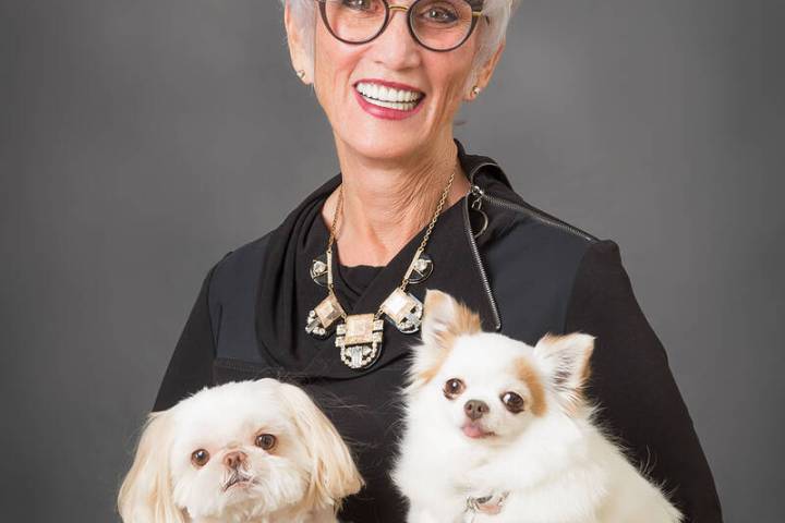 (Photo courtesy of Cokie Booth) Cokie Booth poses with two of her four dogs as a City Council c ...