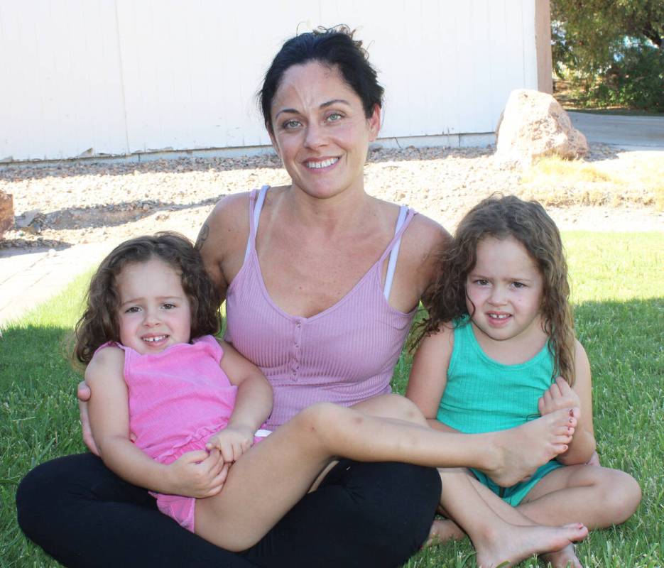 Ron Eland/Boulder City Review Cristin Kennedy with her twin daughters, Laya and Eva. The twins ...