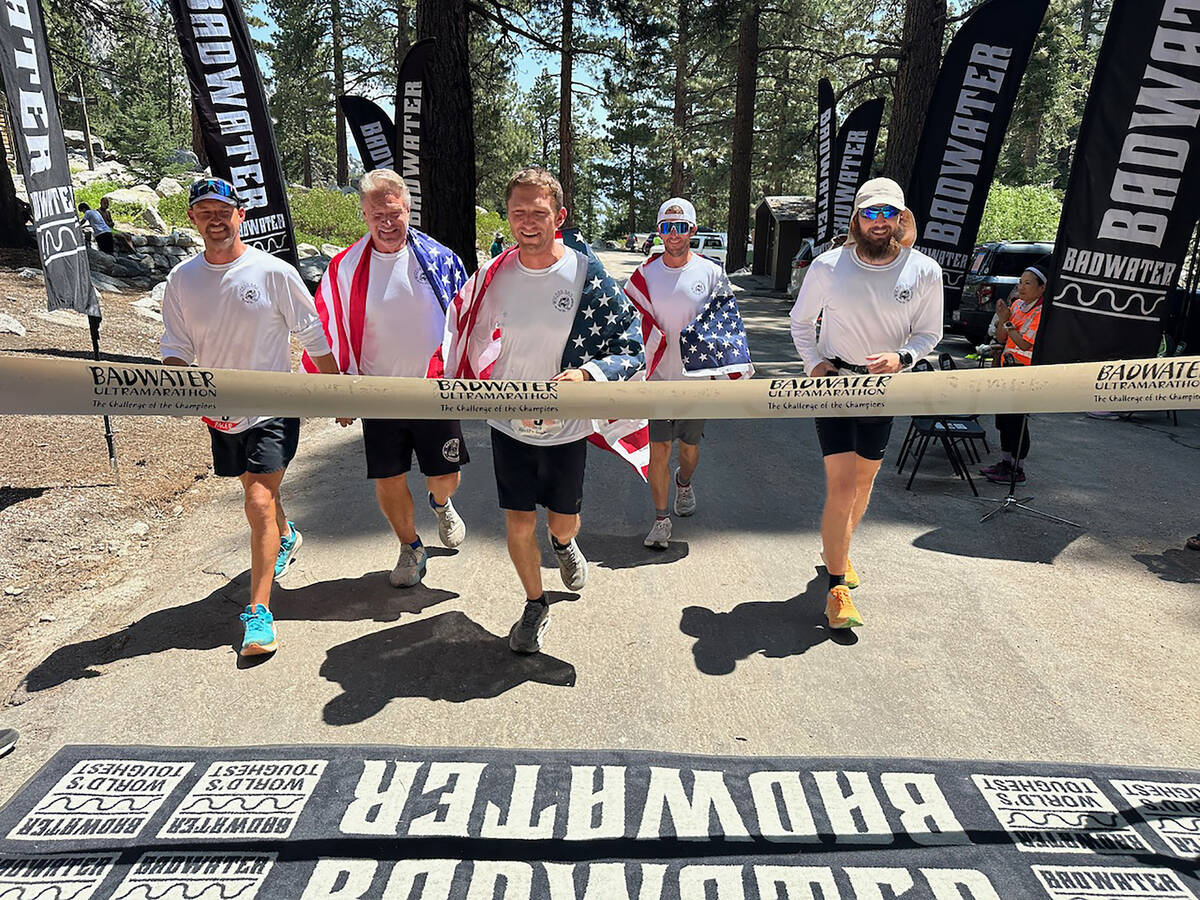 Photo courtesy Tyler Nash As Tyler Nash crossed the finish line, he was joined by members of hi ...