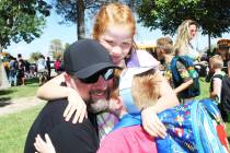 Ron Eland/Boulder City Review James Brainard gets a big hug from daughter Paisley, second grade ...