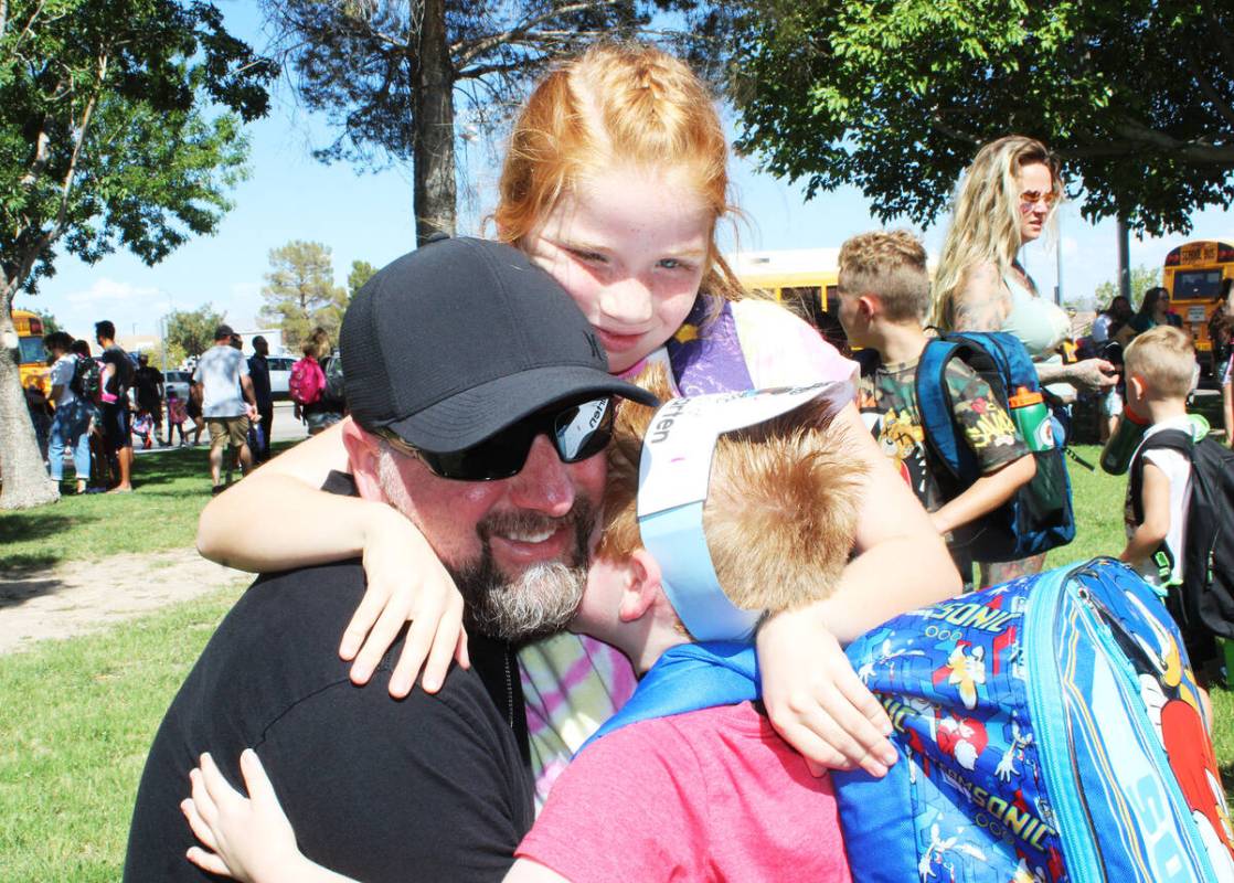 Ron Eland/Boulder City Review James Brainard gets a big hug from daughter Paisley, second grade ...