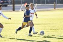 Robert Vendettoli/Boulder City Review Senior Abbey Byington races past a Chaparral defender on ...