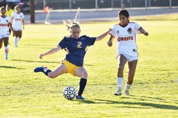 Robert Vendettoli/Boulder City Review Senior Allie Beal pushes the ball up field to senior Maka ...