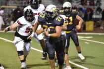 Robert Vendettoli/Boulder City Review Senior Sam Bonar rushes past defenders against Mater East ...