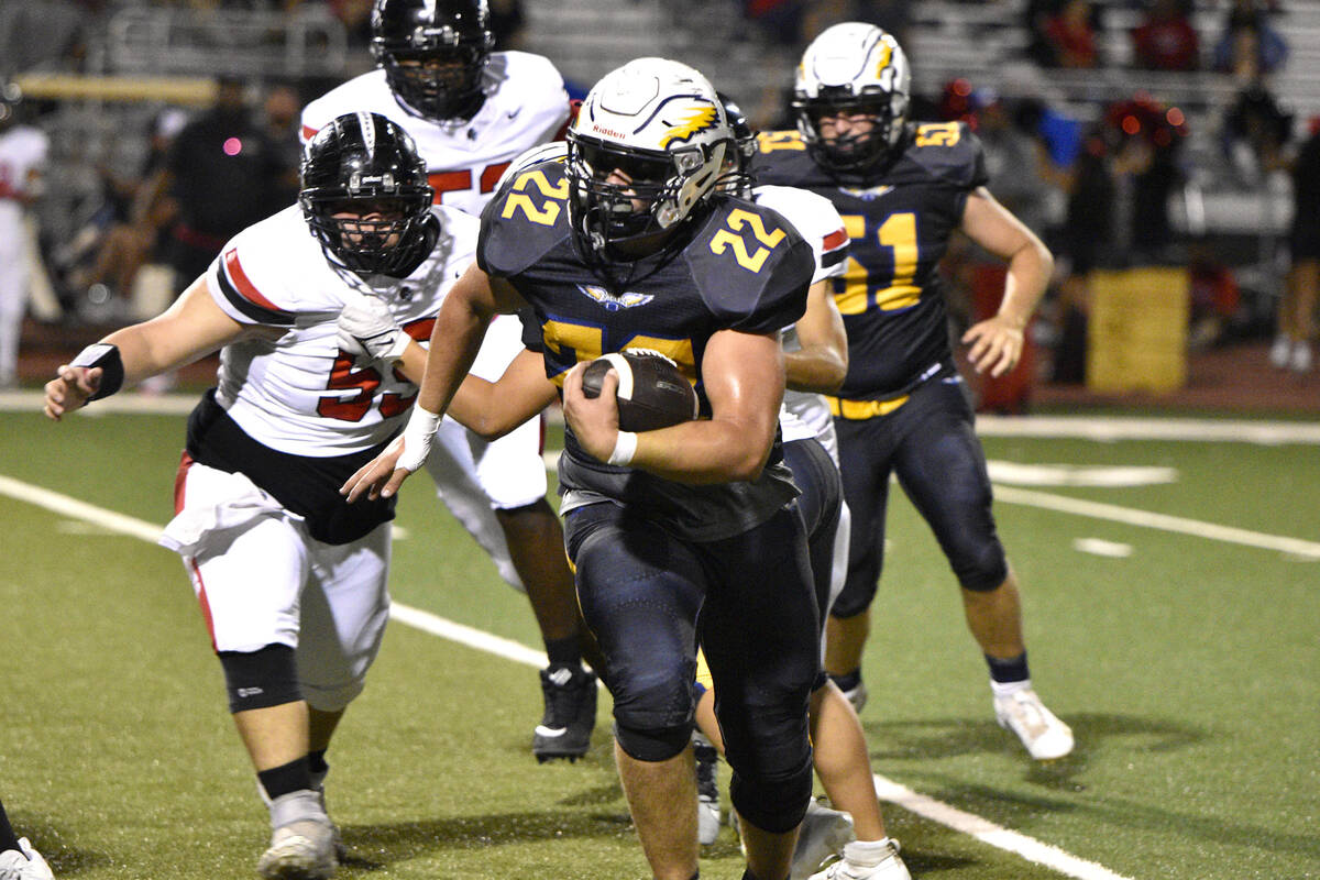 Robert Vendettoli/Boulder City Review Senior Sam Bonar rushes past defenders against Mater East ...