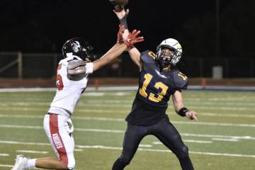 Robert Vendettoli/Boulder City Review Junior quarterback Cameron Matthews launches the ball dow ...