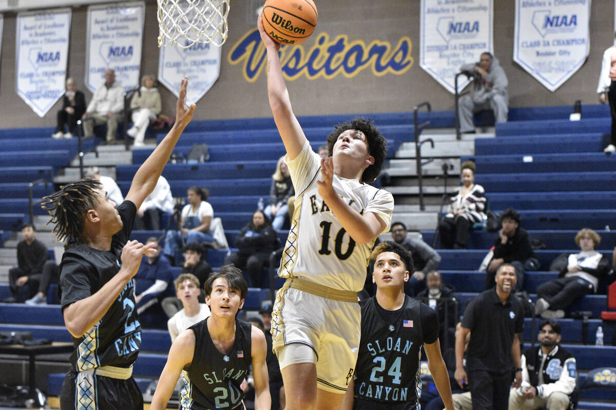 Robert Vendettoli/Boulder City Review Boulder City senior Aiden Birch drives for a layup agains ...