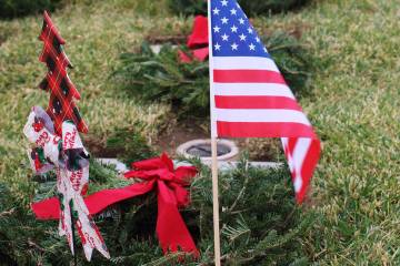 An American flag was placed at one of the gravesites along with a wreath.