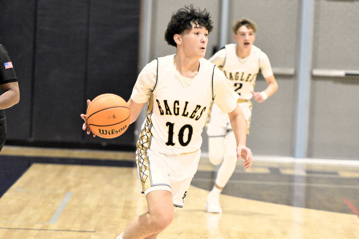 Robert Vendettoli/Boulder City Review Boulder City Senior Aiden Birch brings the ball up court ...