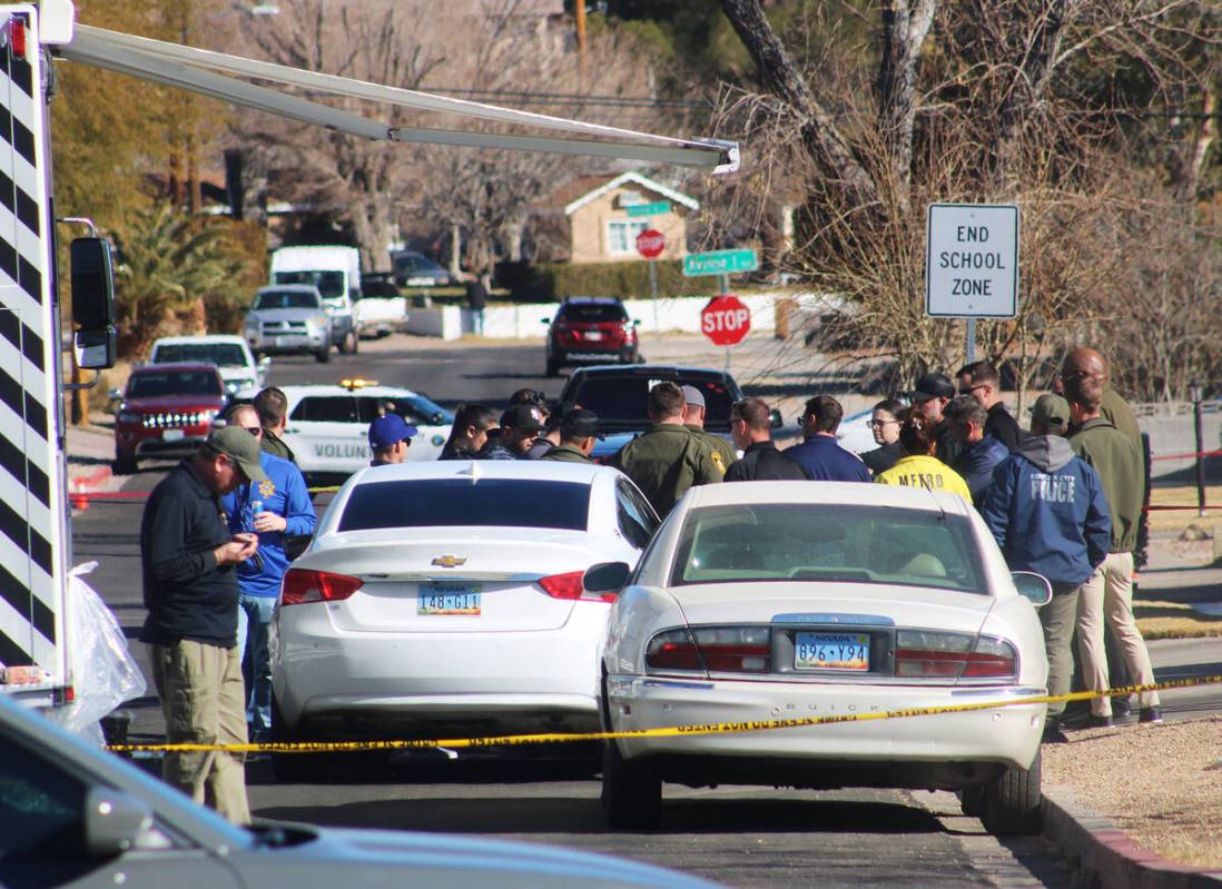 Ron Eland/Boulder City Review Officers from the LVMPD and Boulder City Police Department gather ...