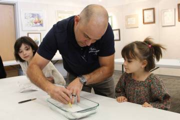 Ron Eland/Boulder City Review Paul Fisher, with his daughters Gyda and Josie watching, showed h ...