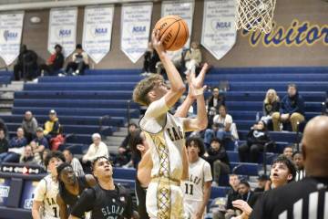 Robert Vendettoli/Boulder City Review Luke Wright goes up for a shot against Sloan Canyon on De ...