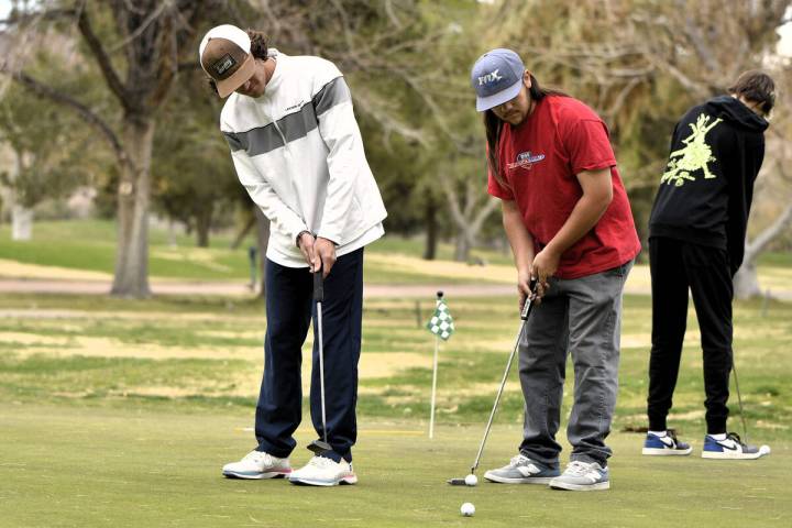 Robert Vendettoli/Boulder City Review Working on their short game, Agustin Acosta and Chase Kov ...