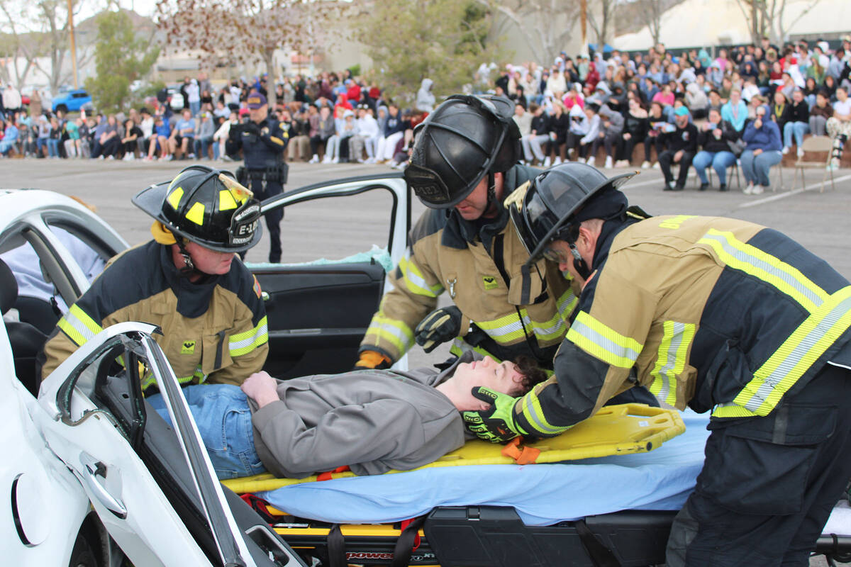 Ron Eland/Boulder City Review Firefighters extract David Zwahlen III, from a vehicle during las ...