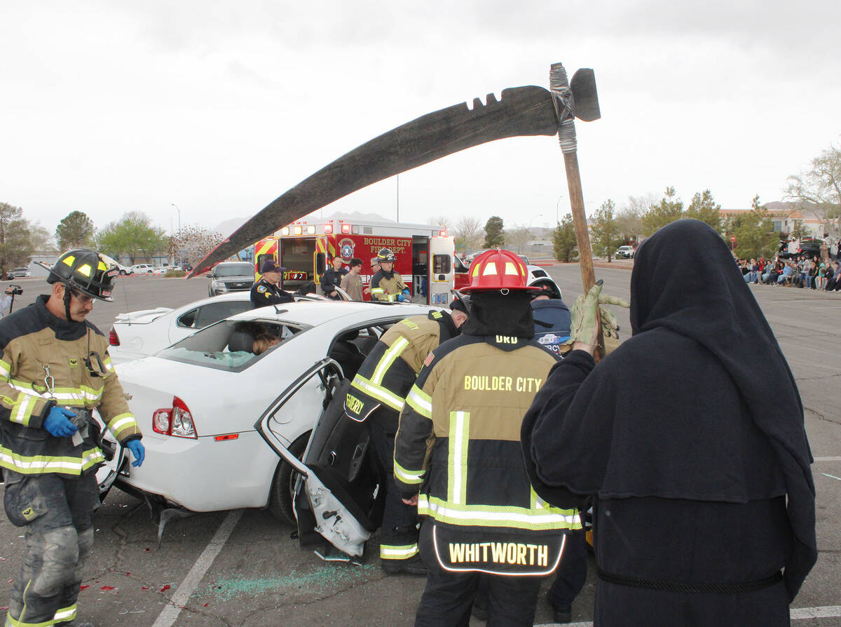 Ron Eland/Boulder City Review With the Grim Reaper looking on, Boulder City firefighters attemp ...