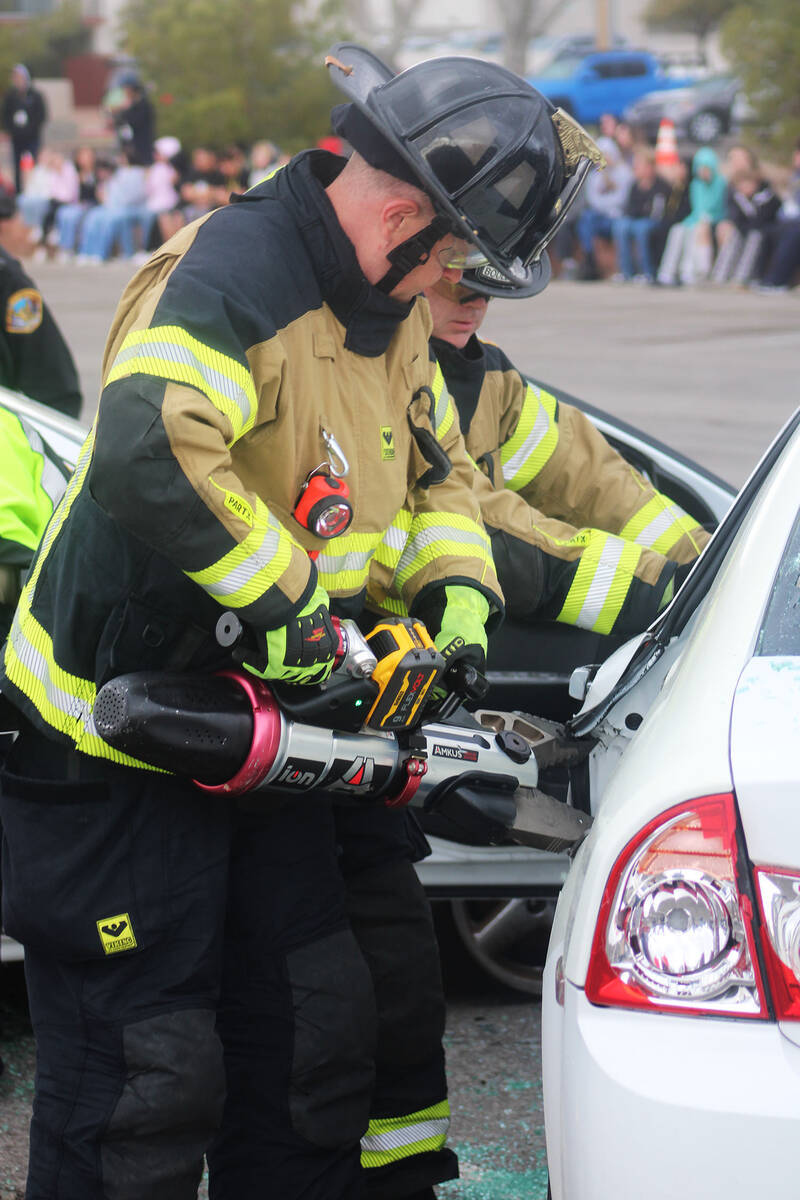 Ron Eland/Boulder City Review Boulder City firefighters use the Jaws of Life to cut off the bac ...