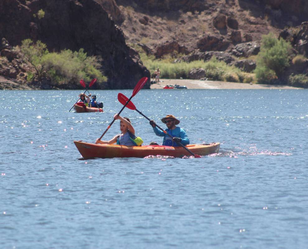 While rafting down the river, it's very common to see other types of watercraft along the way.