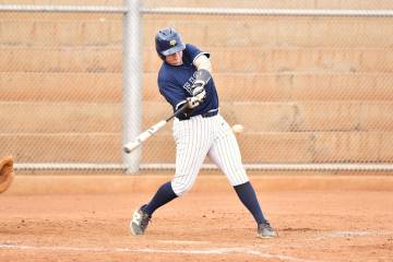 Robert Vendettoli/Boulder City Review Gauge Rhodes drives the ball up the middle for a base hit ...