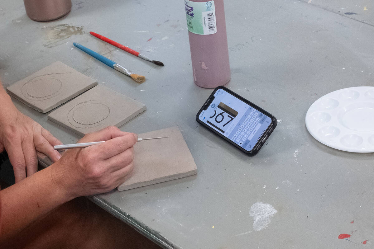 Ian Cruz/Boulder City Review An attendee came to make tiles for their house number, to follow a ...