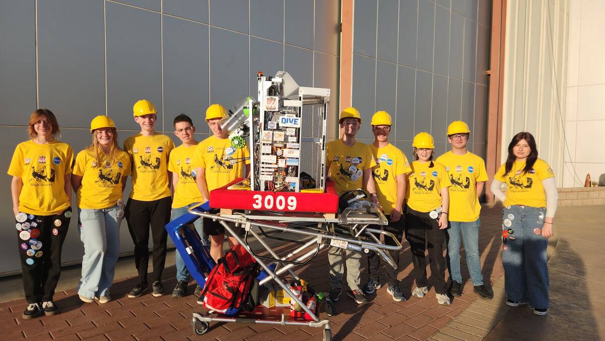 Photos courtesy of Garth Schultz The team shows off this year's robot.