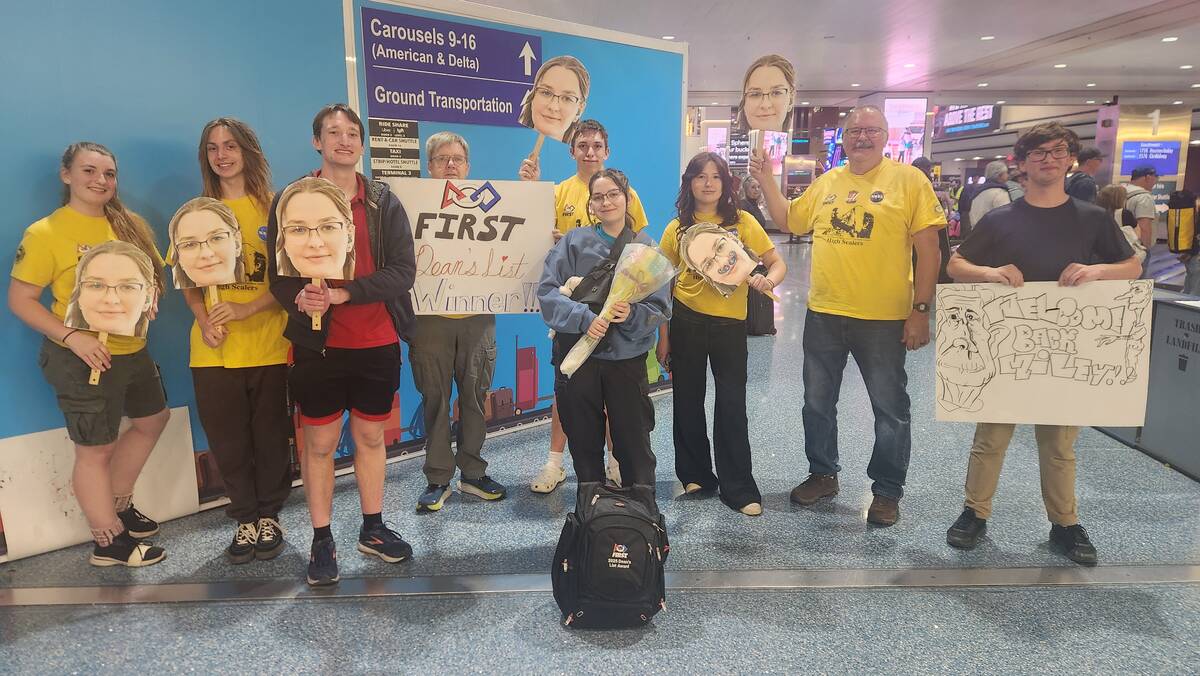 Team members greet Maeili McNary at the airport as she returned from an awards ceremony in Hous ...