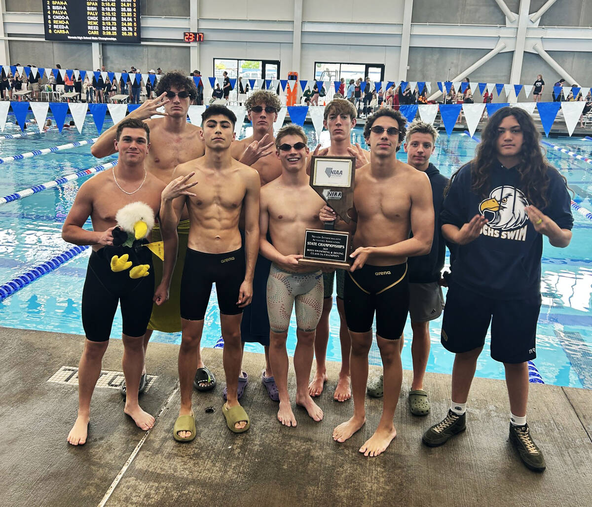 Photo courtesy Sara Carroll Boulder City High School boys swim team celebrates their third cons ...