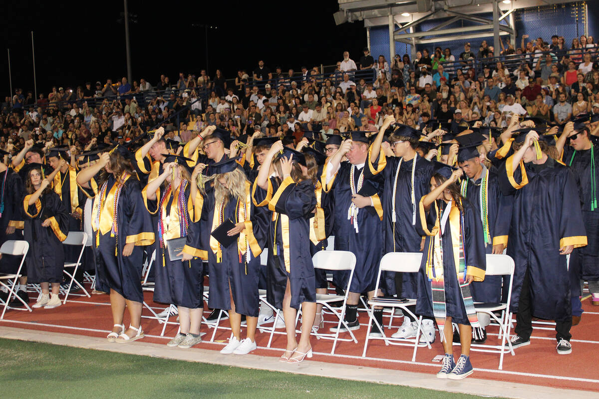 The seniors turned their tassels from one side to another, signifying that they are officially ...