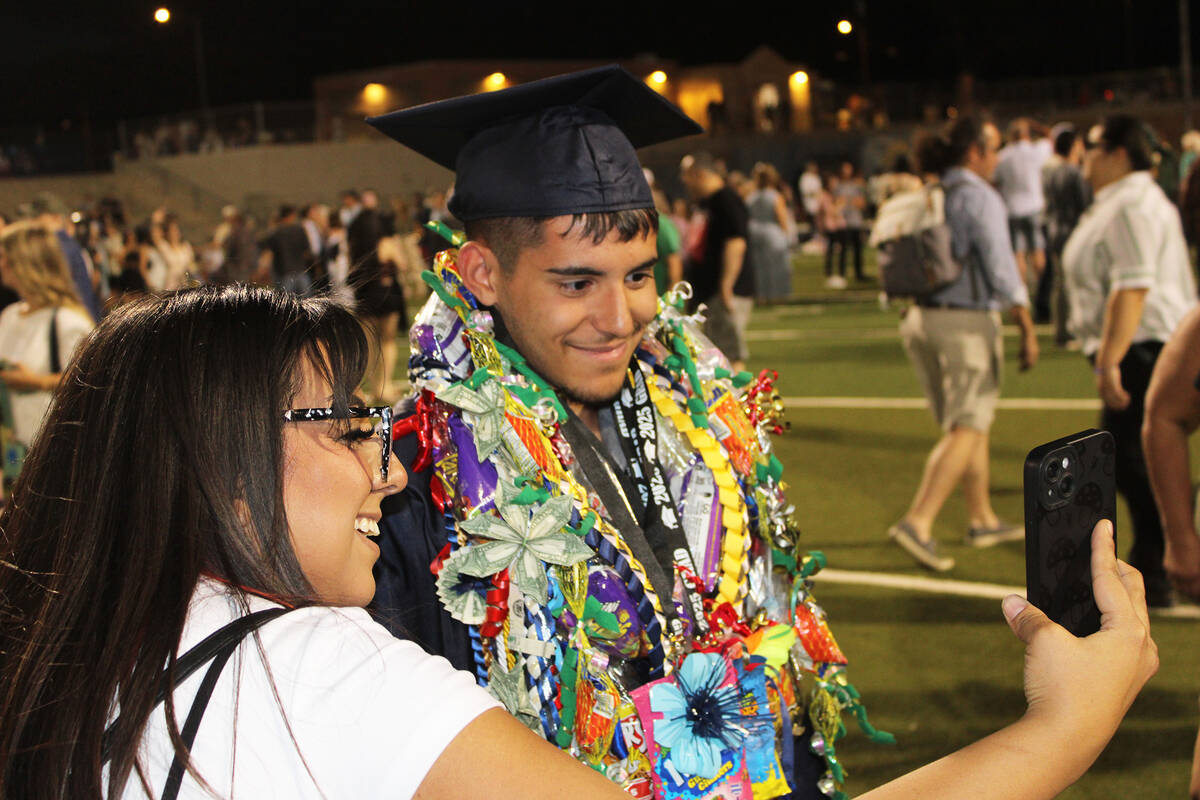 Gianni Alo takes a selfie with a family member after the ceremony.
