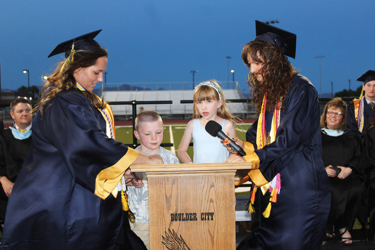 Ron Eland/Boulder City Review With the assistance of two of BCHS’s valedictorians, Hanna ...
