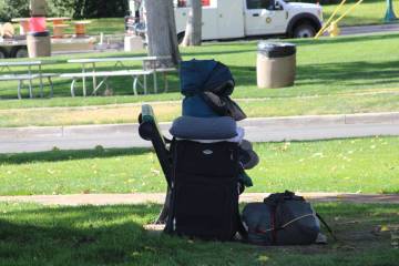 Ron Eland/Boulder City Review A homeless man sleeps on a bench, along with his belongings, last ...