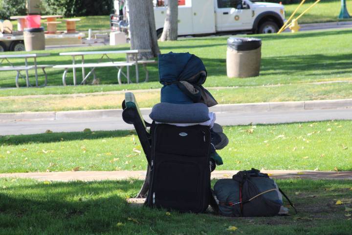 Ron Eland/Boulder City Review A homeless man sleeps on a bench, along with his belongings, last ...