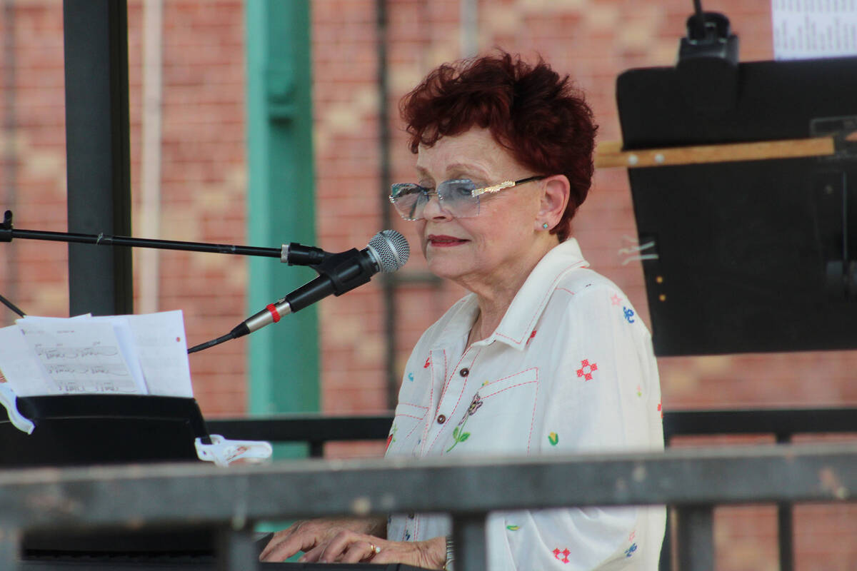 Marlane Coker on piano and vocals.